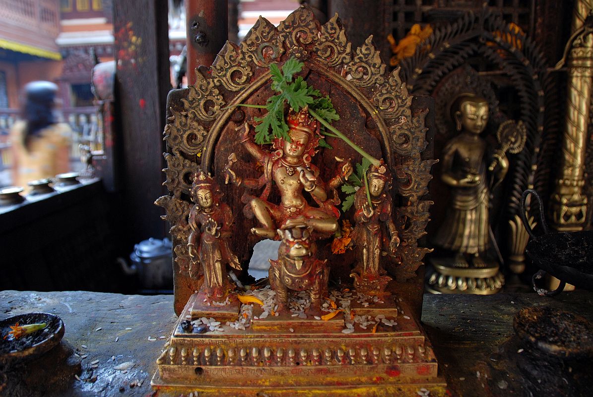 Kathmandu Patan Golden Temple 31 Statue Of Figure With Four Arms Riding On A Snow Lion Outside Entrance Door To The Swayambhu Chaitya 